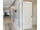Hallway with a decorative rug and a view of the living room at 11395 Lavender Loop, Spring Hill, FL 34609