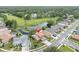 Beautiful aerial view of home, adjacent to a pond and green space, in a well-maintained neighborhood at 11418 Tee Time Cir, New Port Richey, FL 34654