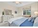 Comfortable bedroom featuring a large window with window seat and a peaceful ambiance at 11418 Tee Time Cir, New Port Richey, FL 34654