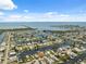 Breathtaking aerial view of waterfront homes on canals, leading to the ocean on a clear, sunny day at 13027 Beacon Ct, Hudson, FL 34667