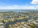 Panoramic aerial view of a beautiful waterfront community showcasing a network of canals with access to the ocean at 13027 Beacon Ct, Hudson, FL 34667