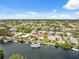 Stunning aerial view showcasing waterfront homes on canals, complete with docks and boats, leading to the ocean at 13027 Beacon Ct, Hudson, FL 34667