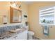 Bright bathroom featuring a granite countertop, white vanity, and updated fixtures at 13027 Beacon Ct, Hudson, FL 34667
