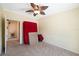 Clean bedroom with a ceiling fan and neutral carpet, perfect for customization at 13027 Beacon Ct, Hudson, FL 34667