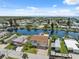 Charming two-story home with a well-manicured lawn, garage, and private dock on a scenic canal at 13027 Beacon Ct, Hudson, FL 34667