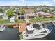Stunning waterfront home boasts a private dock, and a large boat, perfect for enjoying canal living at 13027 Beacon Ct, Hudson, FL 34667