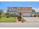 Charming raised bungalow with manicured lawn, lovely landscaping, and a covered front porch at 13027 Beacon Ct, Hudson, FL 34667