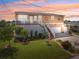 Charming raised bungalow with manicured lawn, lovely landscaping, and a covered front porch at 13027 Beacon Ct, Hudson, FL 34667