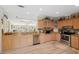 Bright kitchen with granite countertops, stainless steel appliances, and wood-look flooring at 13027 Beacon Ct, Hudson, FL 34667