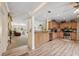 Bright and spacious kitchen with stainless steel appliances and adjacent to the living room at 13027 Beacon Ct, Hudson, FL 34667