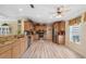 Bright kitchen with granite countertops, stainless steel appliances, and wood-look flooring at 13027 Beacon Ct, Hudson, FL 34667
