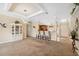 Open-concept living area with a breakfast bar and decorative display cabinet at 13027 Beacon Ct, Hudson, FL 34667