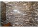 Close-up of the shower with decorative marble-like tile at 13027 Beacon Ct, Hudson, FL 34667