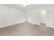 Spacious bedroom features soft carpeting, neutral walls, and two doorways at 13180 Montour St, Brooksville, FL 34613