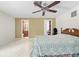 Bedroom with ceiling fan, walk-in closet and attached bathroom at 13180 Montour St, Brooksville, FL 34613