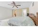 Open bedroom featuring a ceiling fan and tile flooring at 13180 Montour St, Brooksville, FL 34613