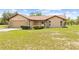 Charming single story home with an attached garage, manicured landscaping and stone accents at 13180 Montour St, Brooksville, FL 34613