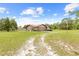 Single story home featuring stone accents, an attached garage and nice landscaping at 13180 Montour St, Brooksville, FL 34613