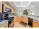 Spacious kitchen with granite countertops and stainless steel microwave at 13180 Montour St, Brooksville, FL 34613