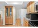 Kitchen area with wood cabinets and a doorway to the rest of the house at 13180 Montour St, Brooksville, FL 34613