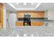 Bright kitchen featuring granite countertops and stainless steel appliances at 13180 Montour St, Brooksville, FL 34613