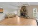 Cozy living room with hardwood floors, stone fireplace and a light and airy atmosphere at 13180 Montour St, Brooksville, FL 34613