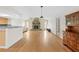 Spacious living room with hardwood floors, a stone fireplace and an open concept design at 13180 Montour St, Brooksville, FL 34613
