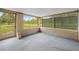 Screened patio overlooking a green lawn and fence at 13180 Montour St, Brooksville, FL 34613