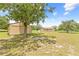 Overview of the property, with the house in the background, and a shed on the left at 13180 Montour St, Brooksville, FL 34613