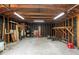 Interior of a wooden shed with storage and concrete floor at 13180 Montour St, Brooksville, FL 34613