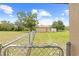 Fenced in grassy yard showing a shed with a trailer parked next to it at 13180 Montour St, Brooksville, FL 34613