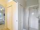 Bright bathroom featuring a glass-enclosed shower and a neutral color scheme at 13321 Norman Cir, Hudson, FL 34669