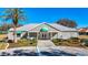 Inviting clubhouse with well-manicured landscaping, parking, and accessible entrance at 13321 Norman Cir, Hudson, FL 34669