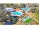 Wide angle view of community shuffleboard, tennis and pool; all well maintained at 13321 Norman Cir, Hudson, FL 34669