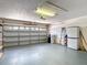 Well-maintained garage with a functional layout and room for vehicles and storage at 13321 Norman Cir, Hudson, FL 34669