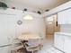 The kitchen includes a breakfast nook with tiled floors and storage cabinets at 13321 Norman Cir, Hudson, FL 34669