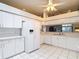 The kitchen offers ample counter space, white cabinets, and modern appliances at 13321 Norman Cir, Hudson, FL 34669