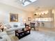 Cozy living area with barstool seating area for the kitchen, and skylight at 13321 Norman Cir, Hudson, FL 34669