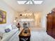 Bright living room with a glimpse into the breakfast bar and hallway at 13321 Norman Cir, Hudson, FL 34669