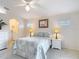 Bright bedroom includes a ceiling fan, and an ensuite bathroom at 13321 Norman Cir, Hudson, FL 34669