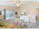 Bright bedroom includes a ceiling fan, and an ensuite bathroom at 13321 Norman Cir, Hudson, FL 34669