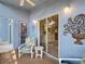 Relaxing patio setup with cozy seating and a charming garden view at 13321 Norman Cir, Hudson, FL 34669