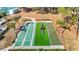 Overhead view of shuffleboard courts with seating and manicured landscaping, in a sunny setting at 13321 Norman Cir, Hudson, FL 34669