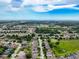 An elevated aerial shot reveals the surrounding area and community near the home at 14655 Potterton Cir, Hudson, FL 34667
