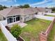 A verdant, fenced backyard with a brick-paved patio and well-maintained landscaping creates a private outdoor space at 14655 Potterton Cir, Hudson, FL 34667