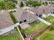 An inviting backyard with a screened lanai, brick-paved patio, and lush lawn offers a tranquil outdoor retreat at 14655 Potterton Cir, Hudson, FL 34667