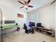 Bedroom featuring a green desk, gaming chair and computer accessories at 14655 Potterton Cir, Hudson, FL 34667