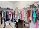 Walk-in closet provides ample storage space with clothing racks and some shelving at 14655 Potterton Cir, Hudson, FL 34667