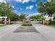 Welcoming gated entrance to the Highlands community featuring brick pillars and lush landscaping at 14655 Potterton Cir, Hudson, FL 34667