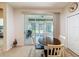 Bright dining area with sliding glass doors leading to a screened patio, perfect for indoor-outdoor living at 14655 Potterton Cir, Hudson, FL 34667